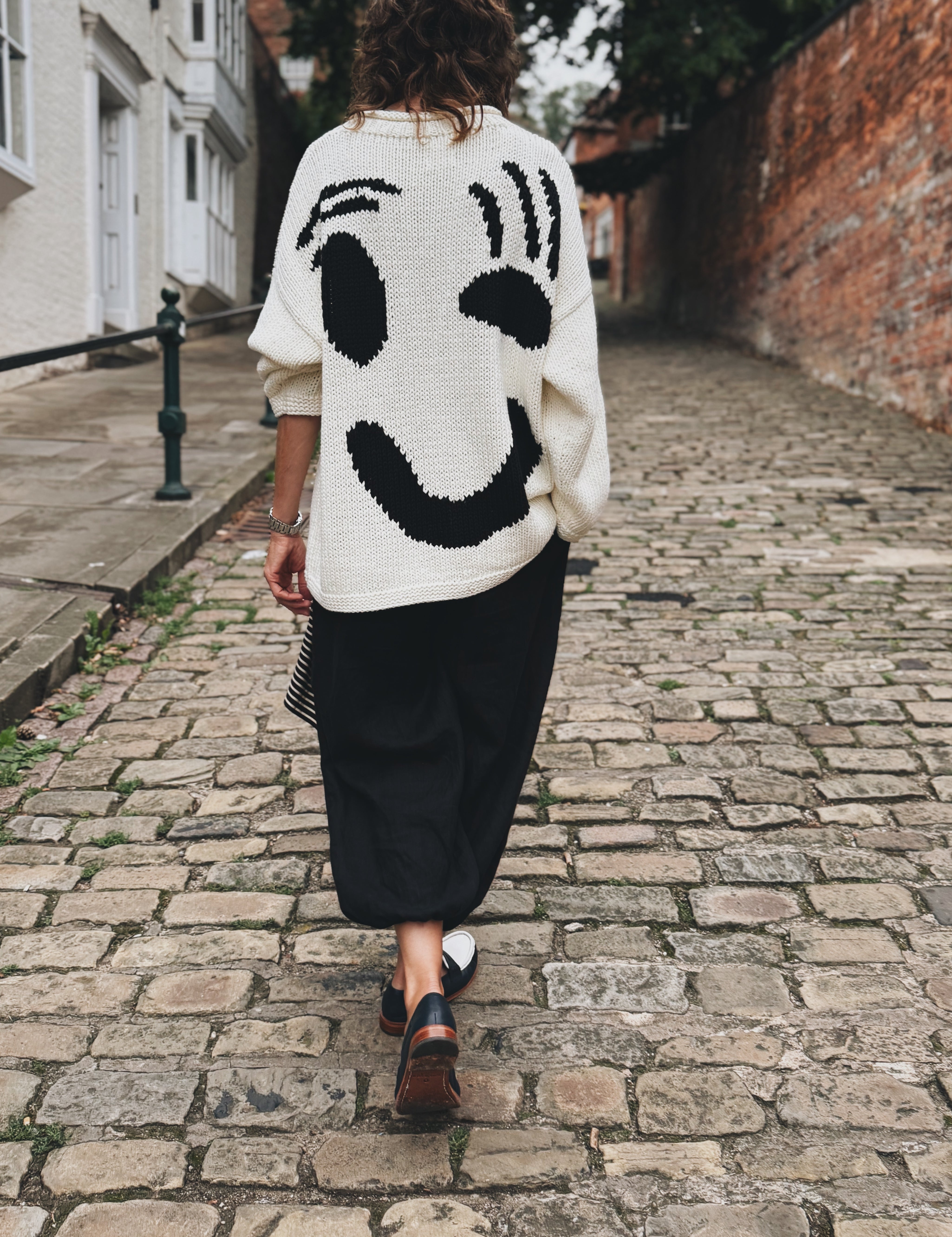 Back view of oversized black and white hand knitted cotton jumper