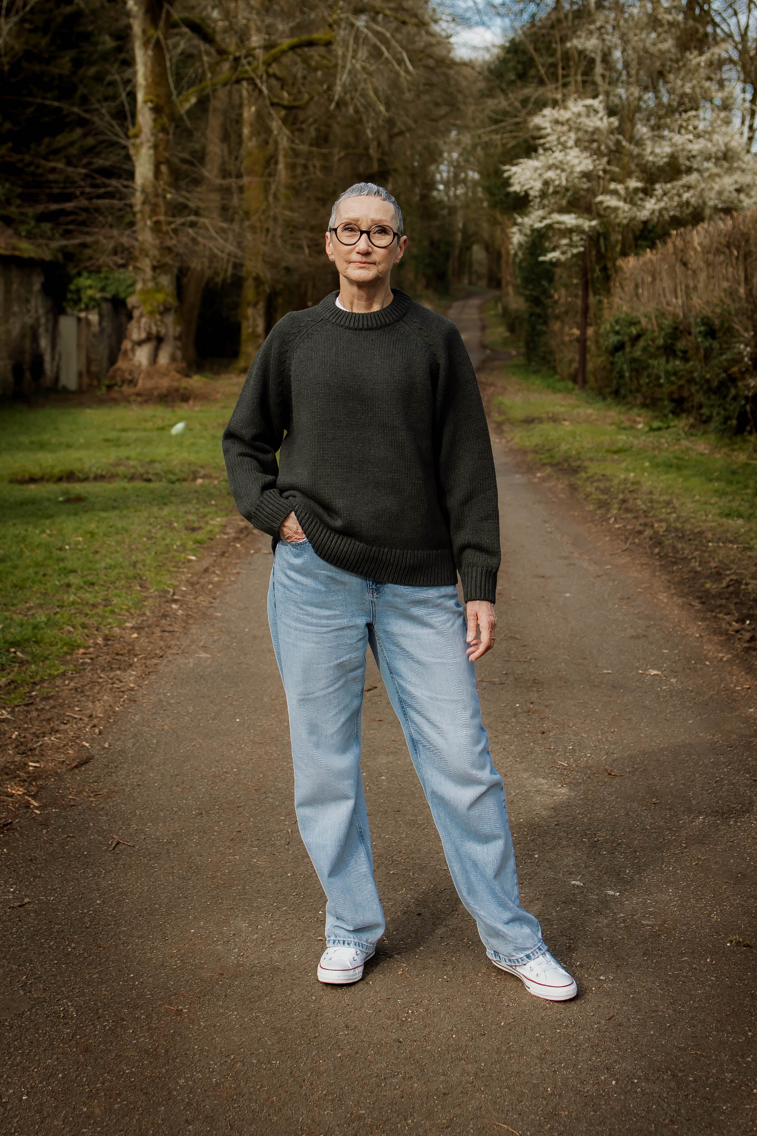 Model wearing the relaxed Charcoal Staple Crew Jumper by Slow Love Knitwear