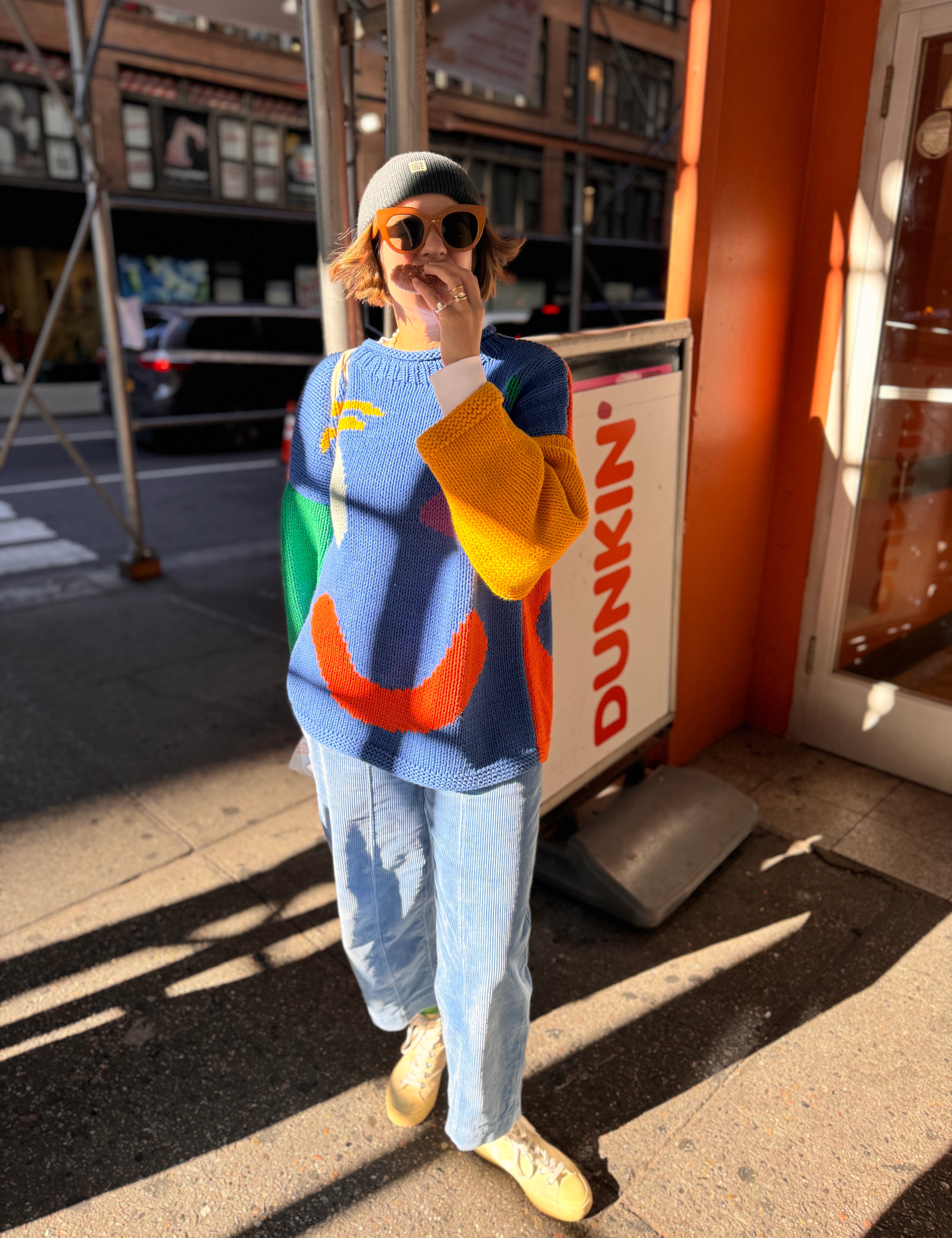 Detail of chunky cotton jumper sleeve in colour block pattern