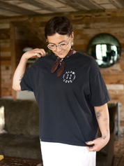 Compass faded black oversized boxy t-shirt by Slow Love Knitwear made from heavyweight organic cotton, front view.