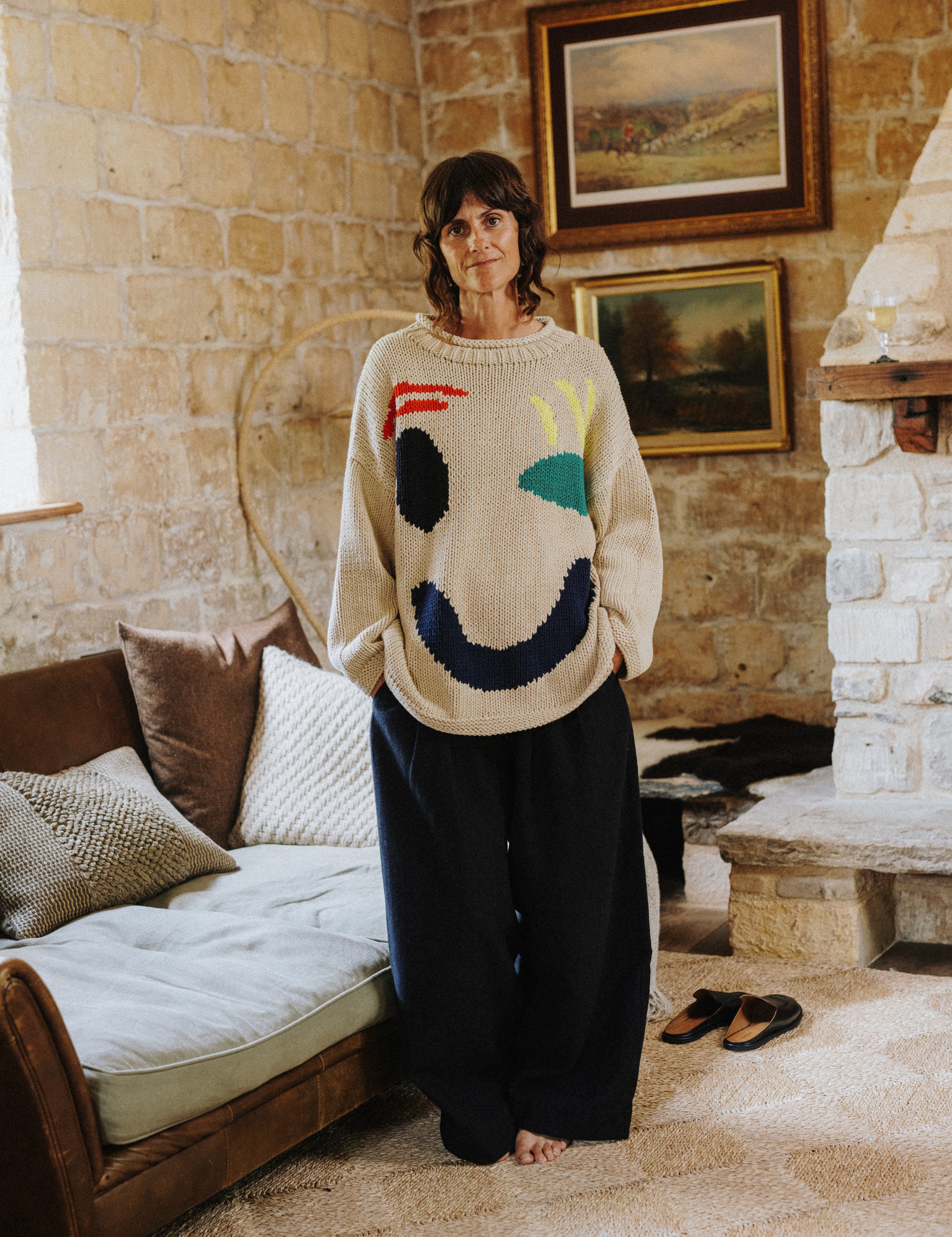 Model wearing the oversized ecru Feel Good Hand Knit Jumper by Slow Love Knitwear