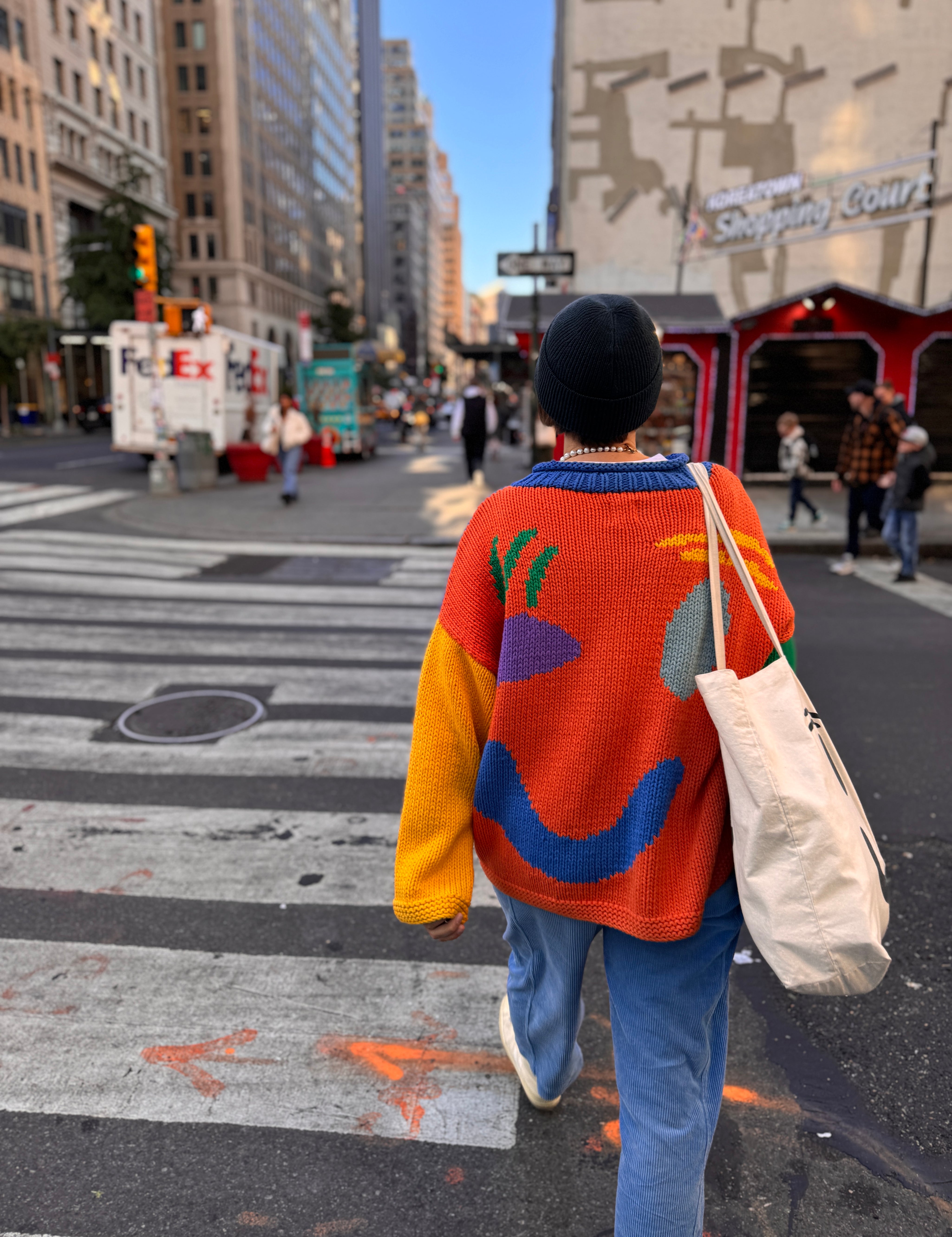 Back motif detail on oversized colour block hand knitted jumper