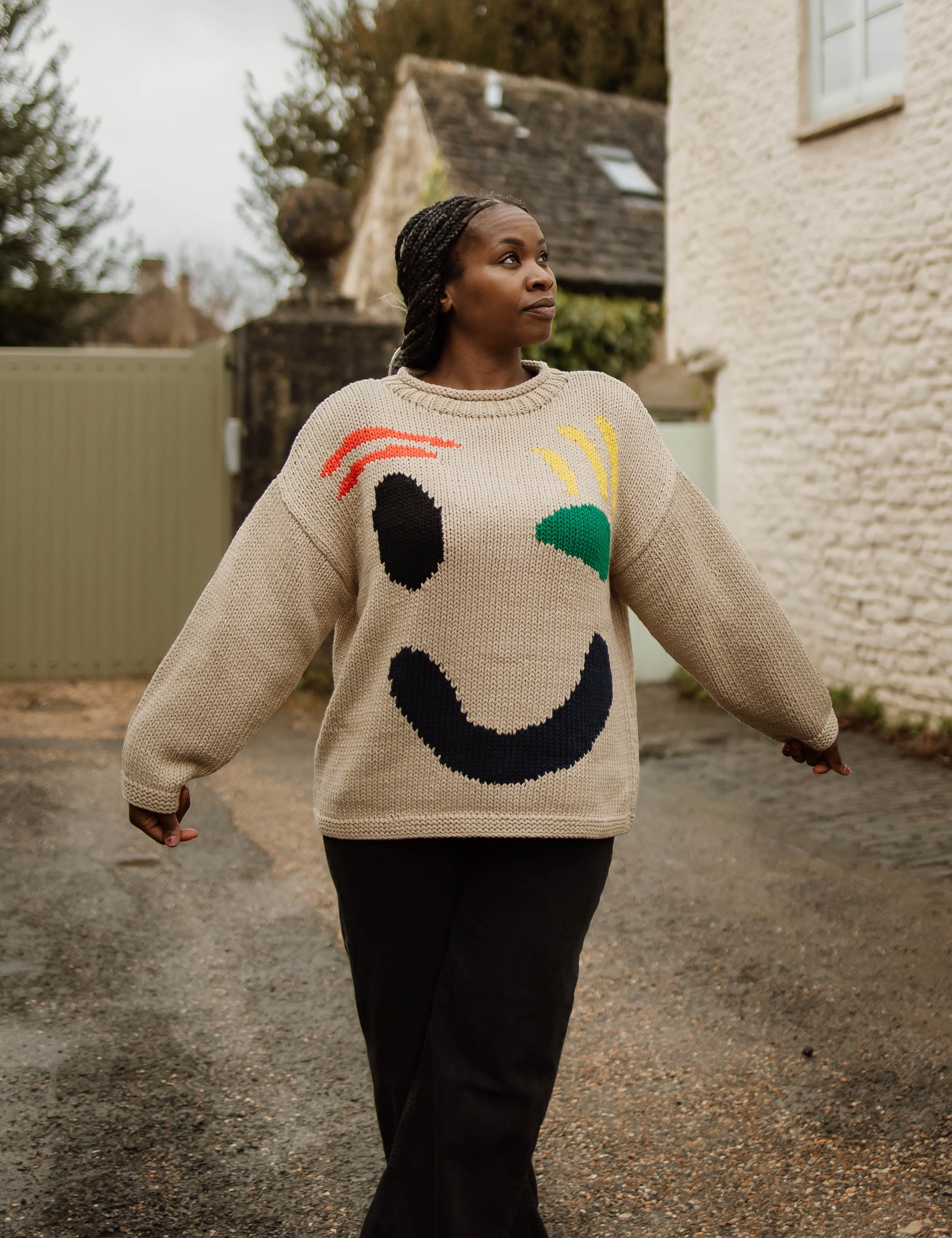 Close up of Feel Good motif on front of hand knit jumper
