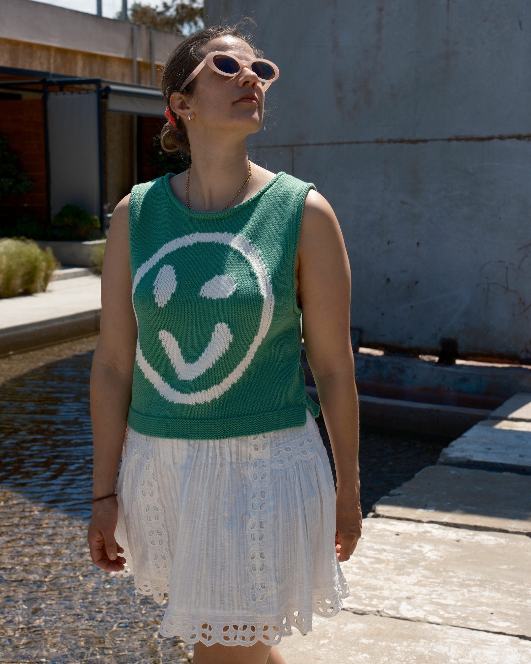 Green and white cotton knit tank top with smiley face motif by Slow Love Knitwear