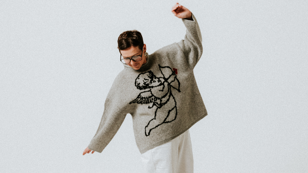 Grey Cherub knit jumper by Slow Love with a relaxed silhouette, cosy wool texture and signature cherub design.