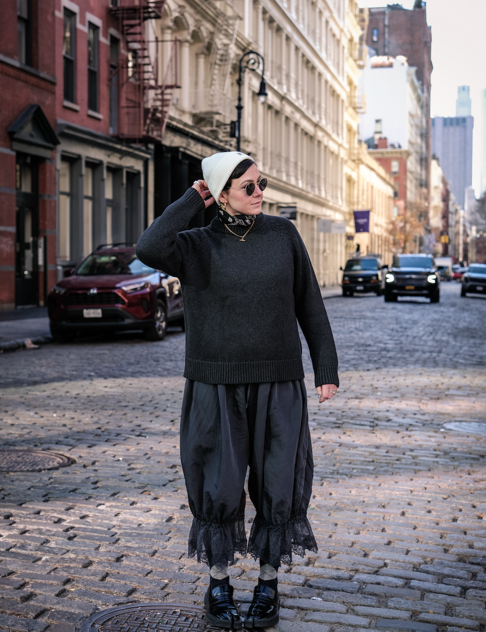 Model wearing the relaxed Charcoal Staple Crew Jumper by Slow Love Knitwear