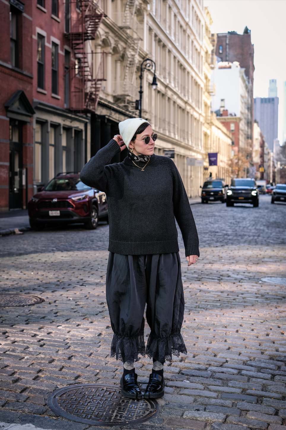 Model wearing the relaxed Charcoal Staple Crew Jumper by Slow Love Knitwear