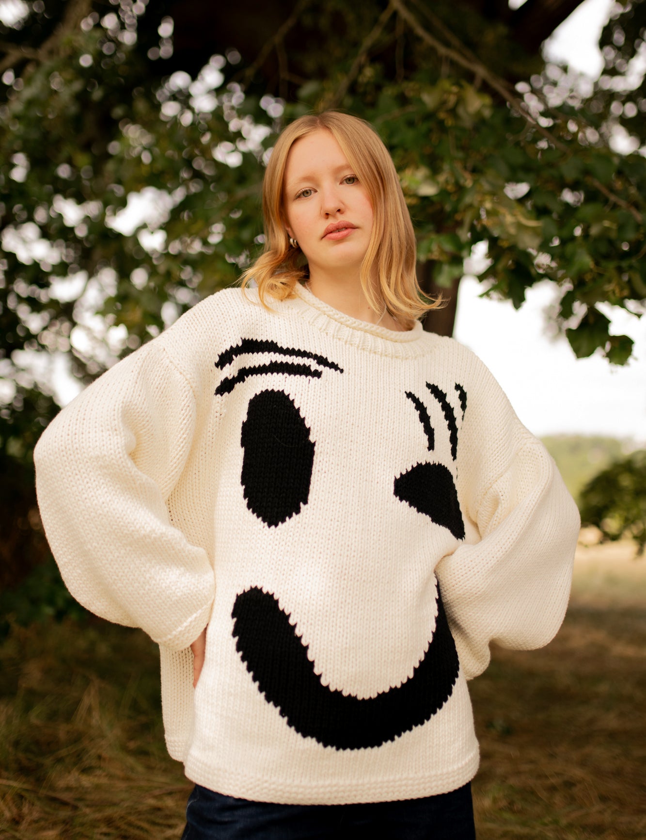 Styled monochrome hand knit jumper worn in casual outfit