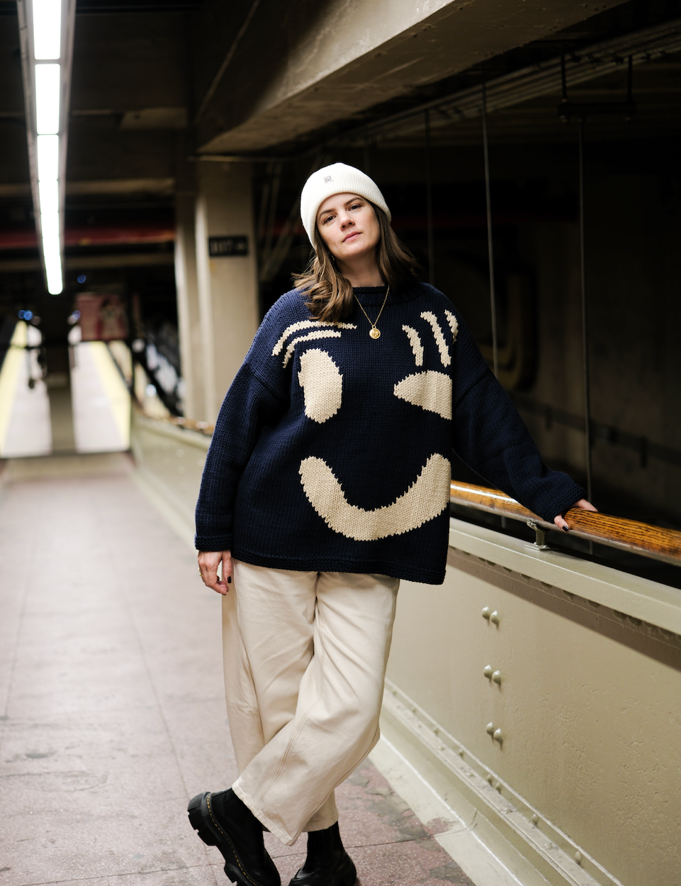 Full length view of oversized cotton hand knit jumper on model