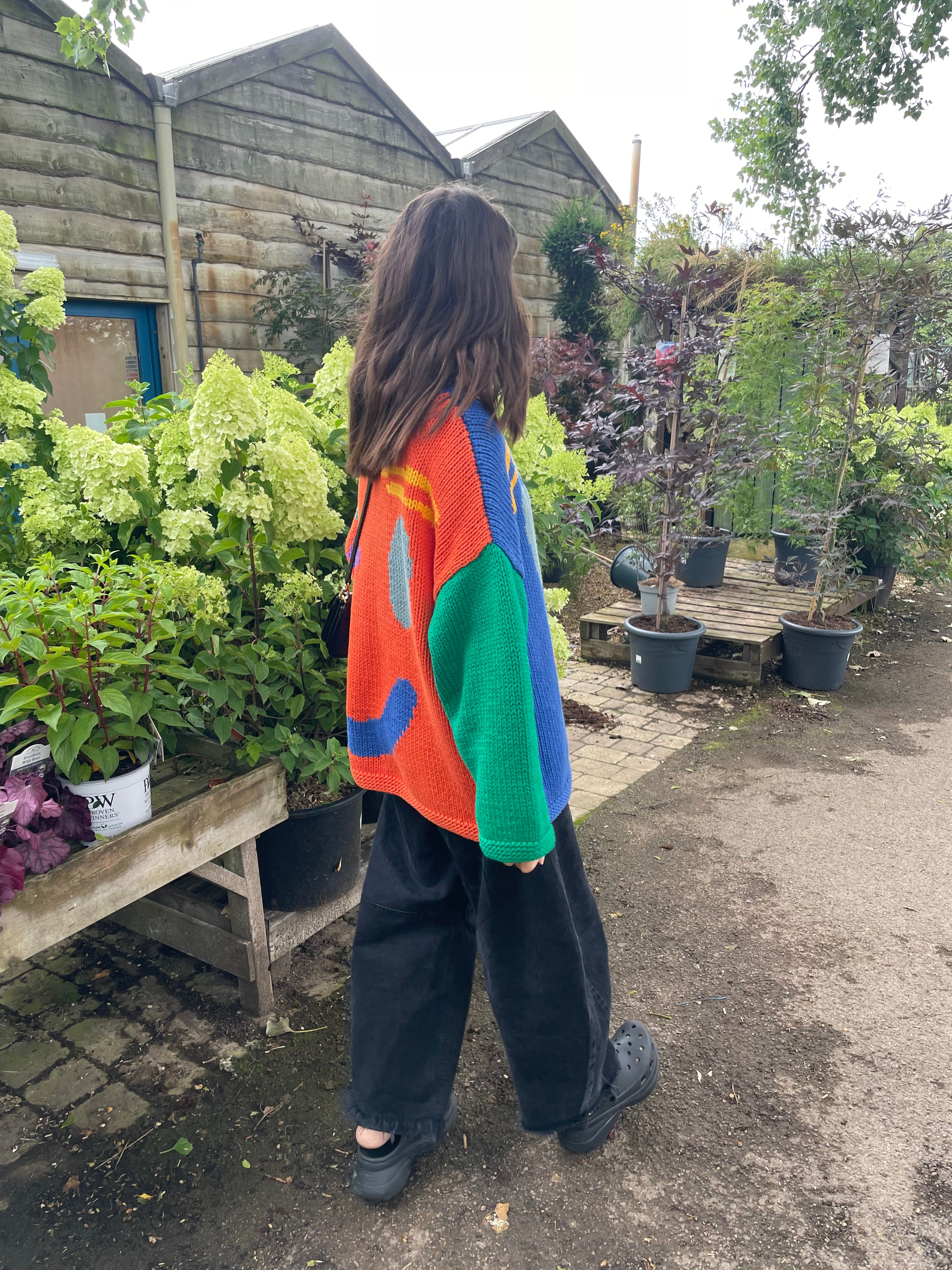 Side profile of oversized multicoloured cotton jumper showing boxy fit
