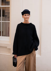 Plain hand knit jumper in black front view