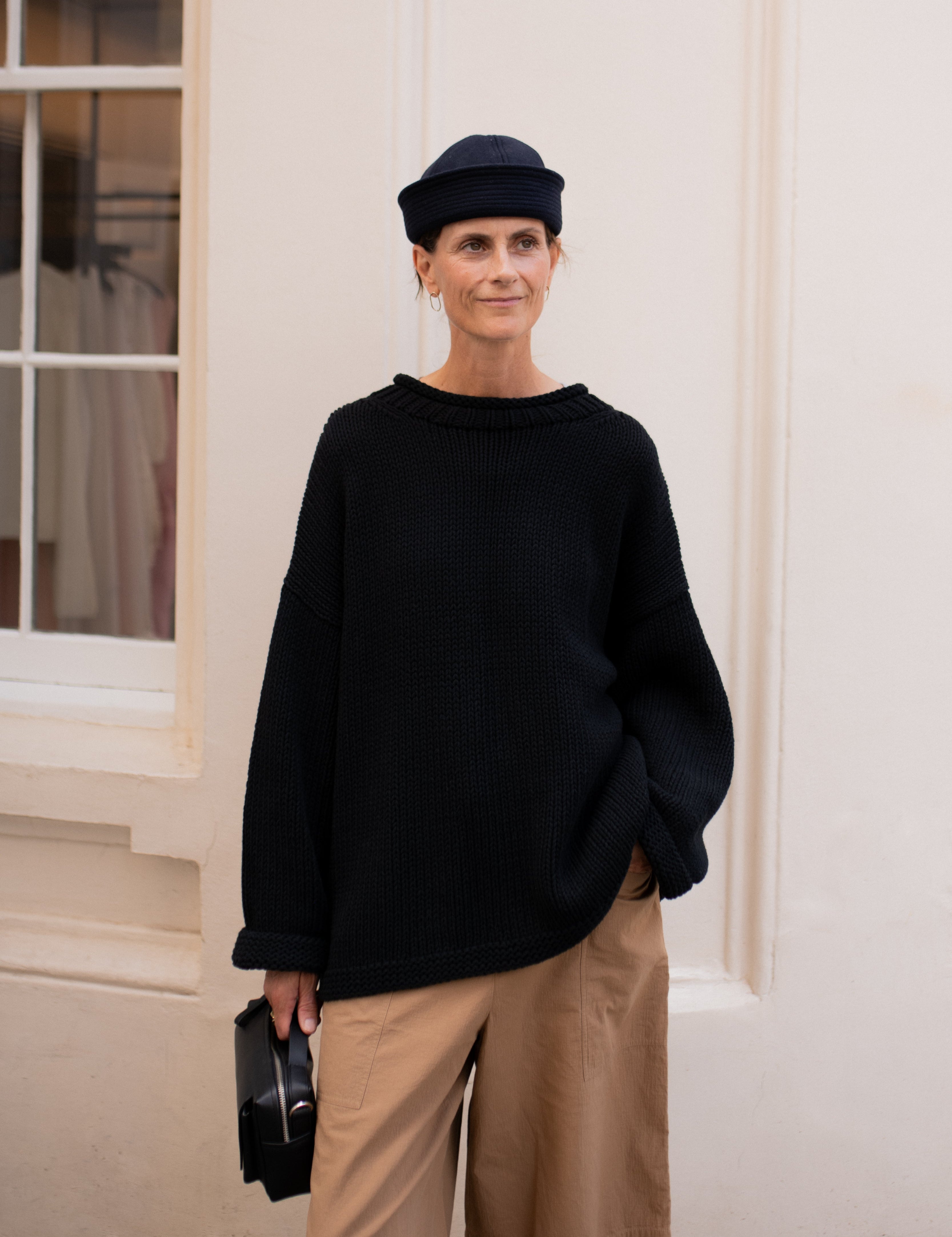 Plain hand knit jumper in black front view