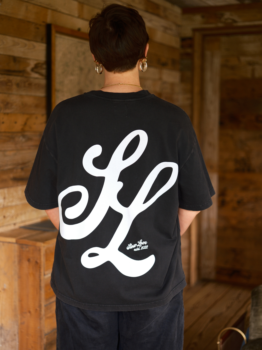 Premium faded black oversized t-shirt by Slow Love Knitwear with a structured boxy fit.