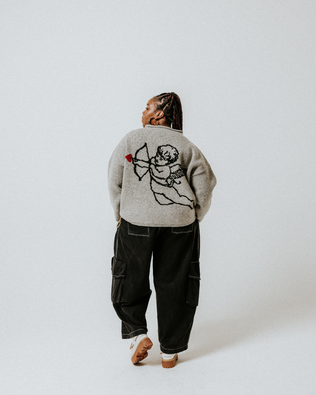 Back of the Grey Cherub wool jumper by Slow Love with a playful graphic design and relaxed, oversized fit.