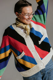 Close up of seven colour intarsia stripe pattern on handknit cotton cardigan by Slow Love Knitwear