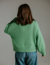Back view of boxy 100 percent cotton knit green jumper with relaxed fit by Slow Love Knitwear