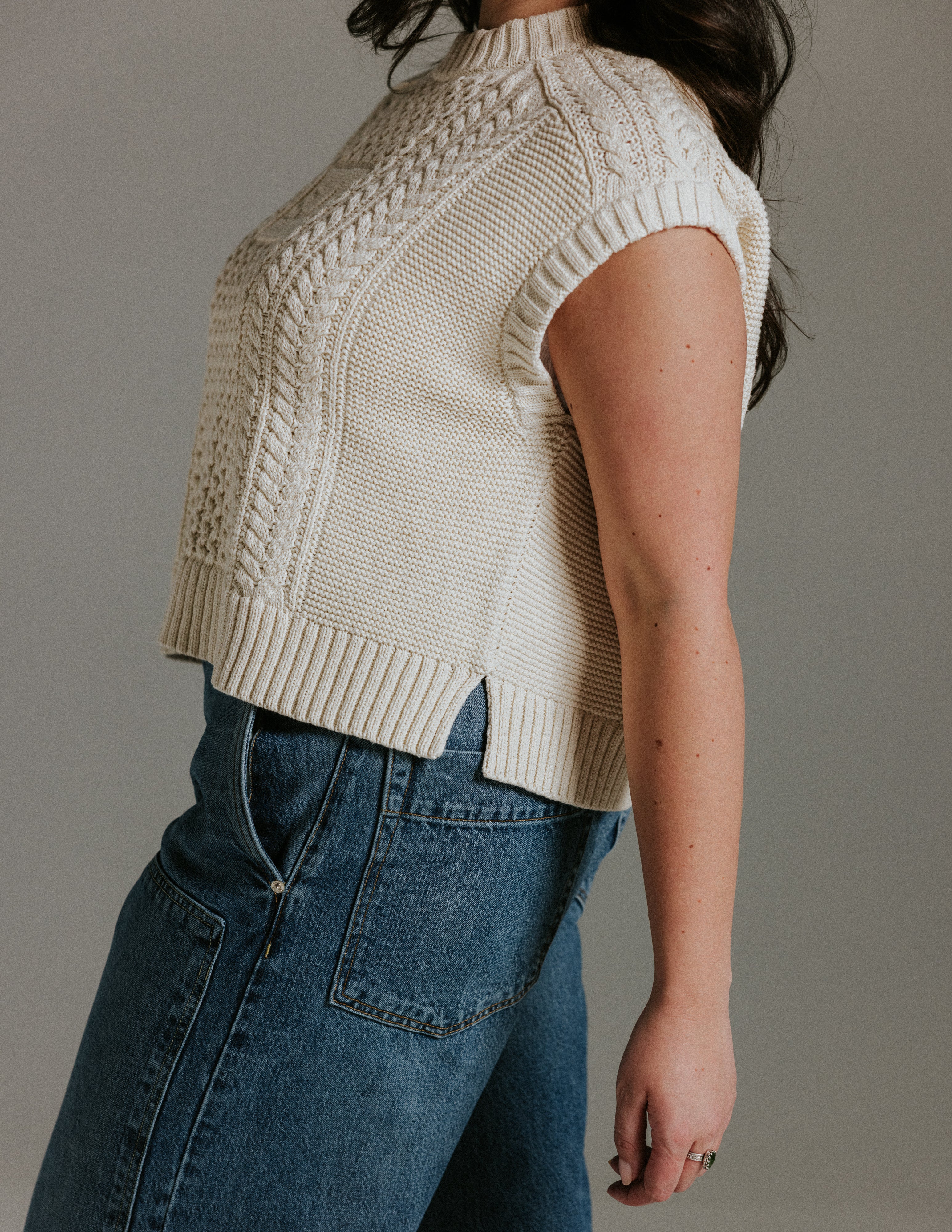 Side view of boxy cotton knit tank top by Slow Love Knitwear based on Aran jumper design