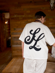 Back view of the Slow Love Script oversized boxy t-shirt in off white organic cotton.