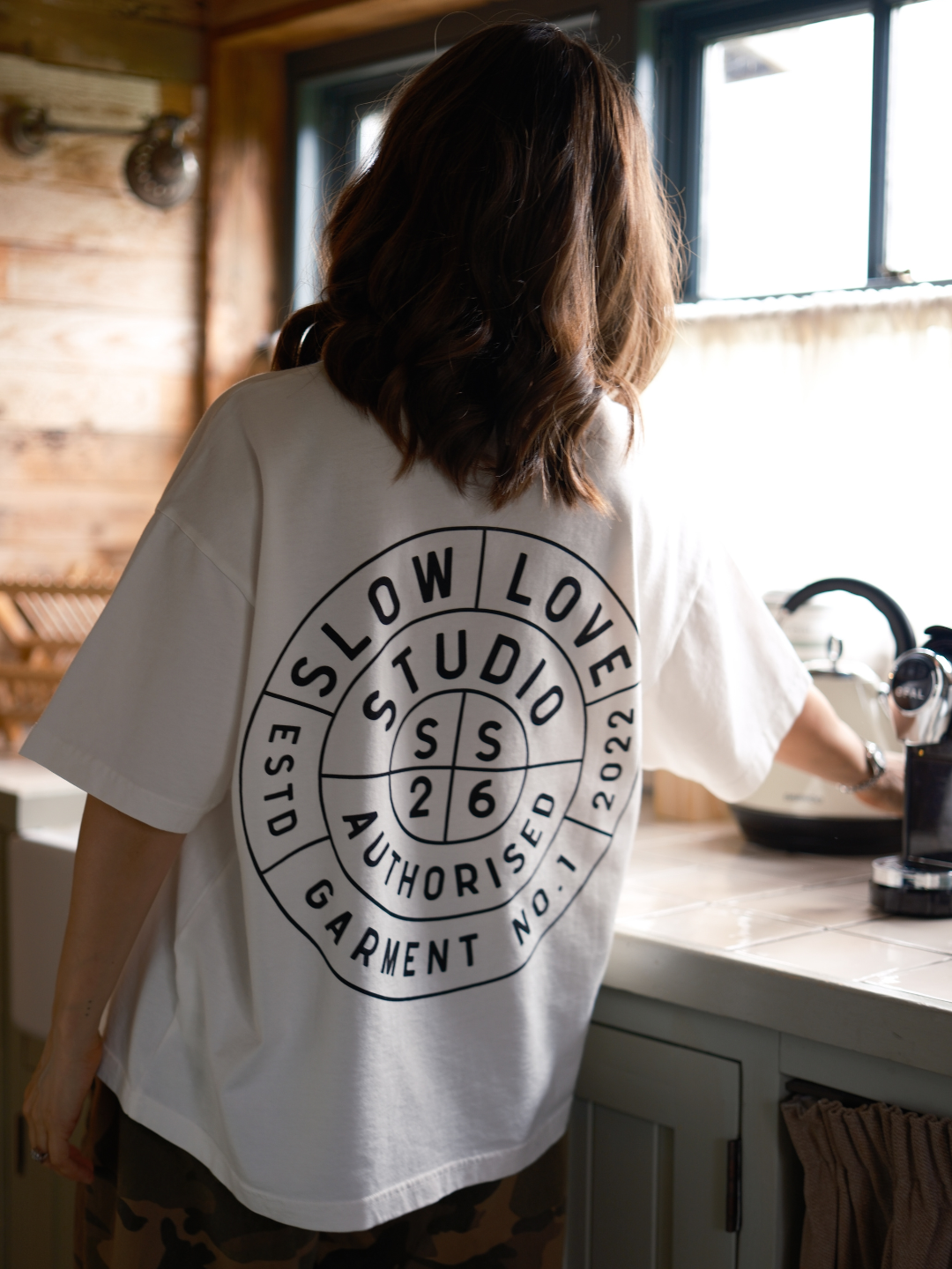 Off white Compass t-shirt by Slow Love Knitwear crafted from premium 250gsm organic cotton.