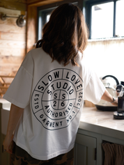 Off white Compass t-shirt by Slow Love Knitwear crafted from premium 250gsm organic cotton.