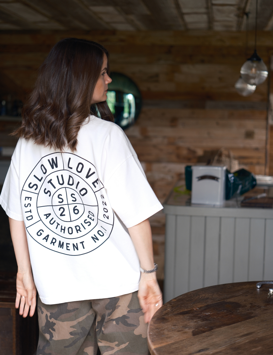Back view of the Compass oversized boxy t-shirt in off white organic cotton.