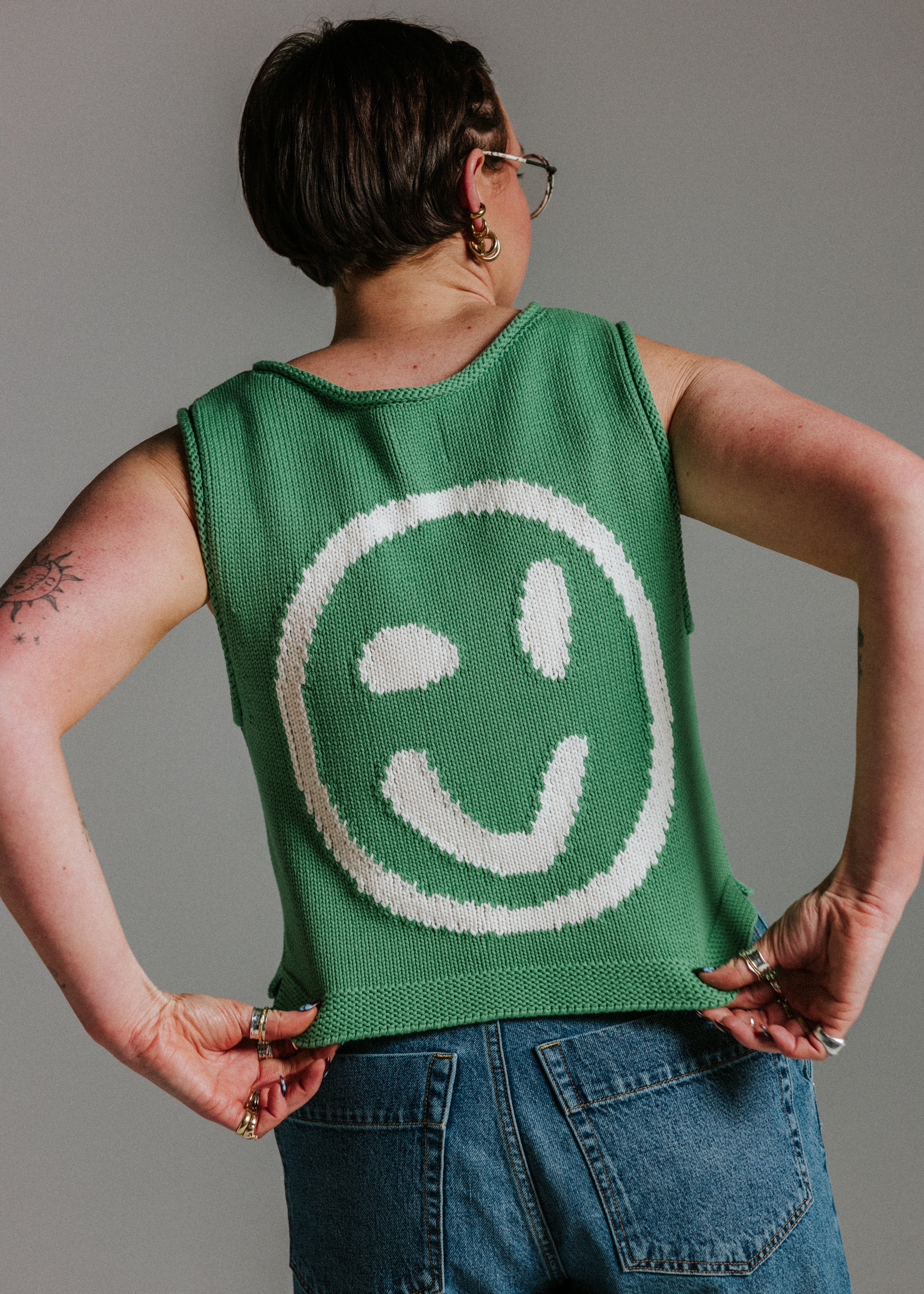 Close up of green and white 100 percent cotton knit tank top texture by Slow Love Knitwear