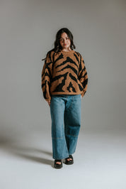 Model wearing cropped hand knitted cotton jumper with intarsia tiger pattern by Slow Love Knitwear