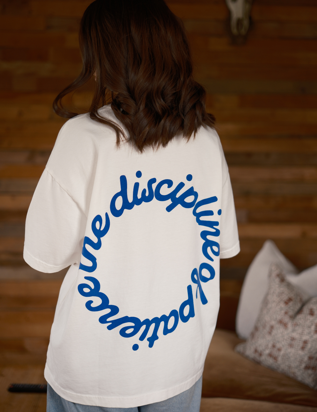 Back view of the Discipline of Patience oversized boxy t-shirt by Slow Love Knitwear crafted from premium organic cotton.