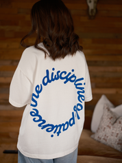 Back view of the Discipline of Patience oversized boxy t-shirt by Slow Love Knitwear crafted from premium organic cotton.