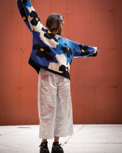 Women’s floral hand knit jumper featuring bold pansy motifs and colourful intarsia detailing