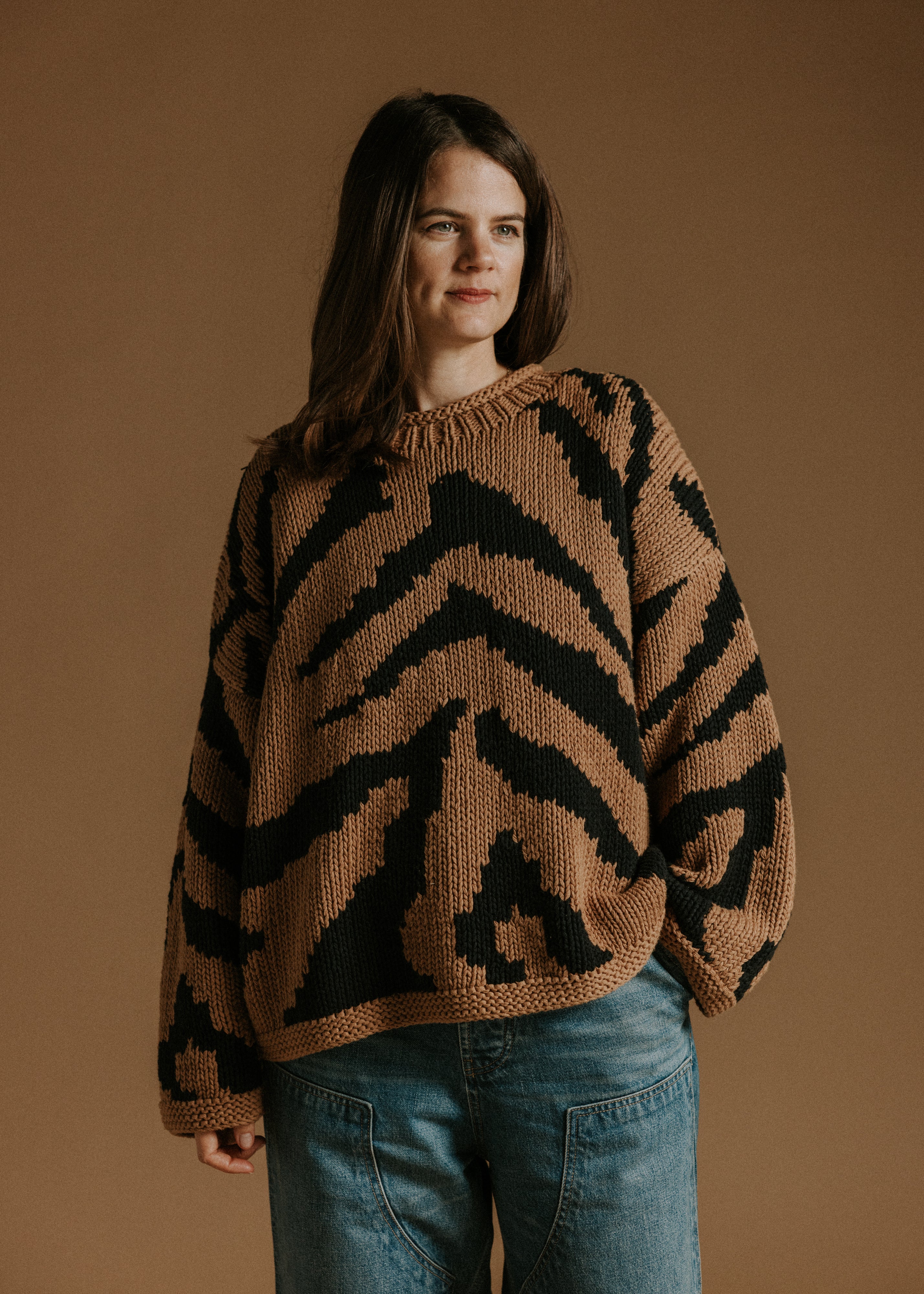 Hand knitted cotton jumper by Slow Love Knitwear with two colour intarsia tiger pattern
