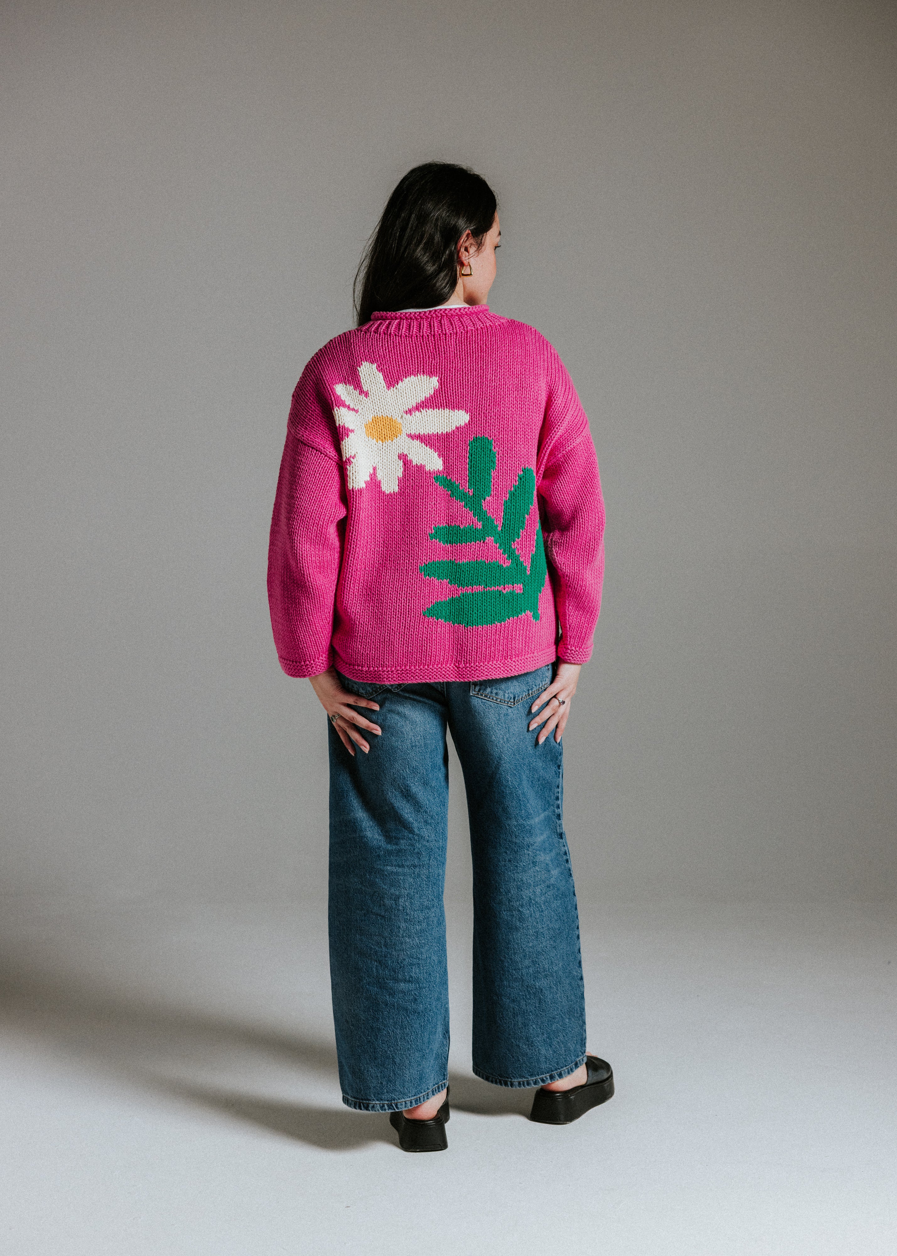Another back view of hand knitted cotton jumper with daisy intarsia motif by Slow Love Knitwear