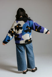 Back view of hand knitted cotton jumper with floral intarsia design by Slow Love Knitwear