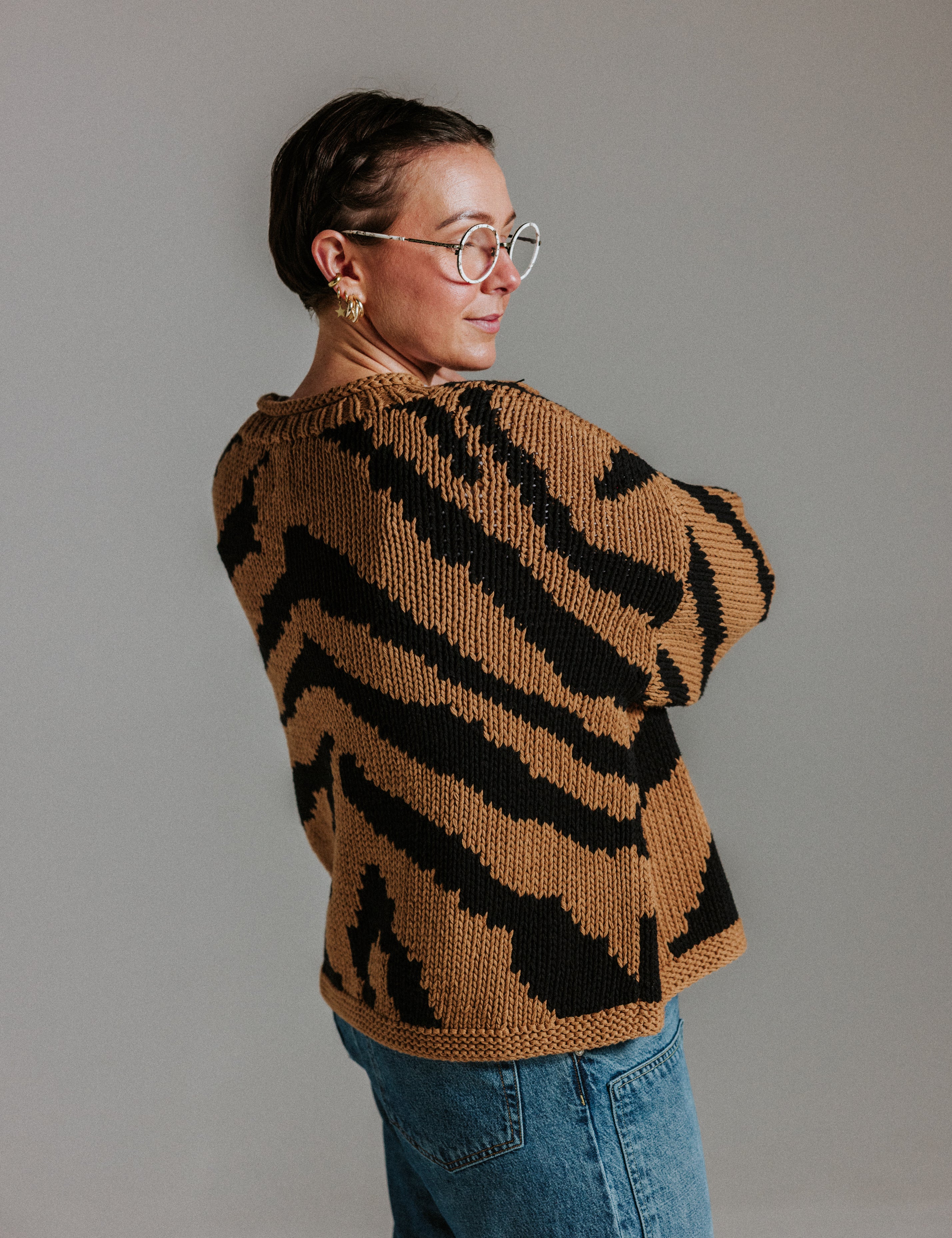 Back view of hand knitted cotton jumper with intarsia tiger design by Slow Love Knitwear