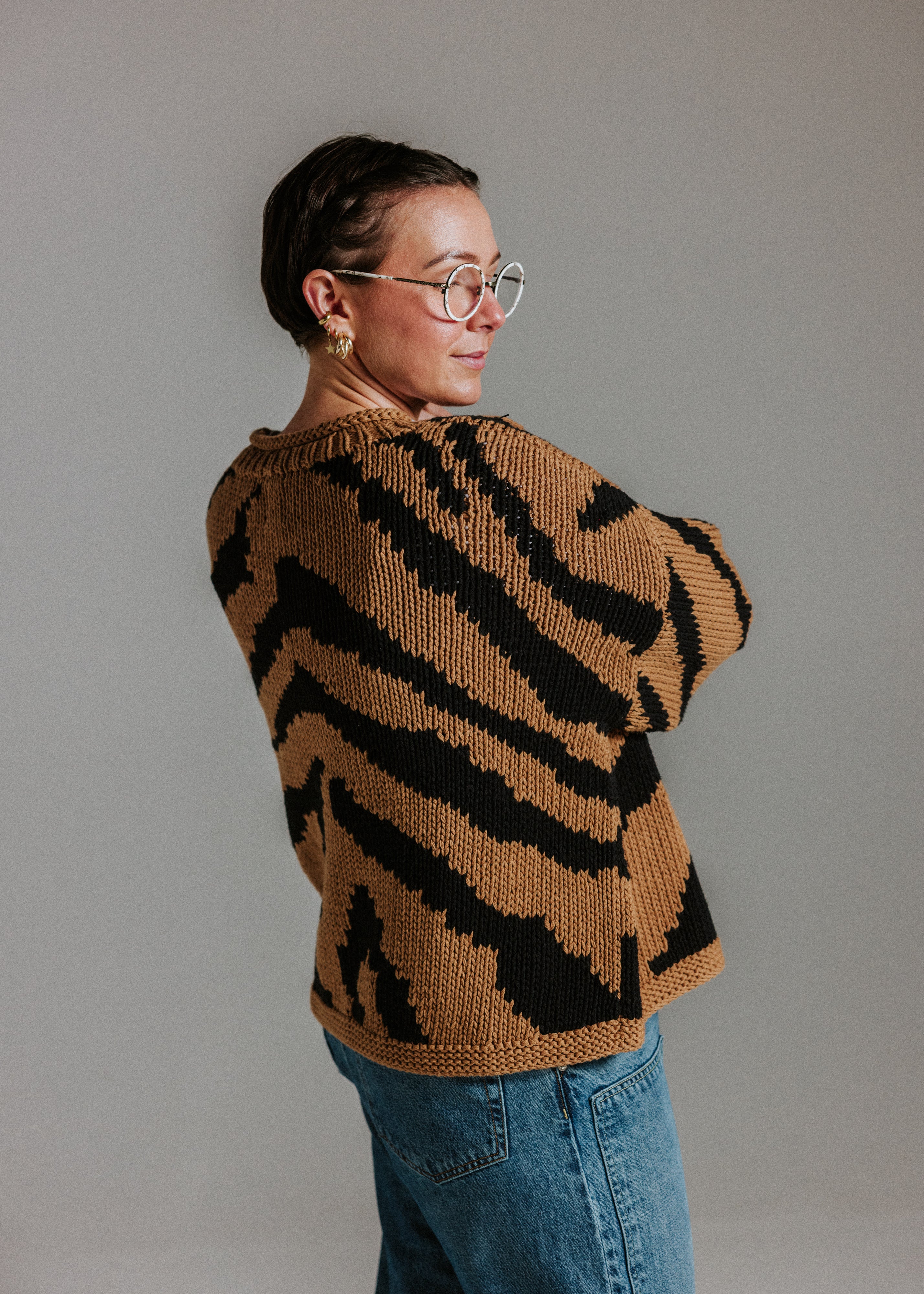 Back view of hand knitted cotton jumper with intarsia tiger design by Slow Love Knitwear