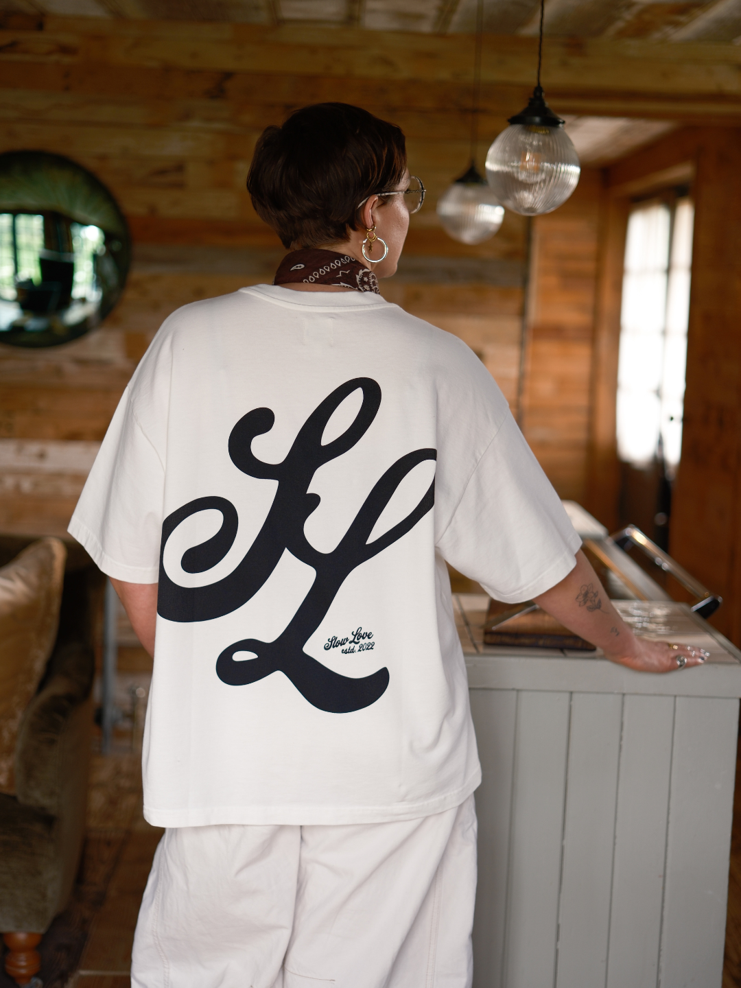 Off white Slow Love Script t-shirt by Slow Love Knitwear crafted from premium 250gsm organic cotton.