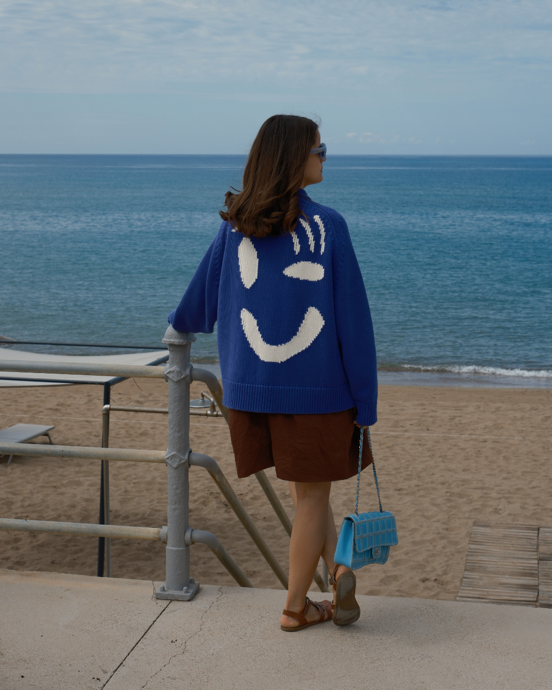 Relaxed grandad fit cardigan with statement white smiley face detail by Slow Love Knitwear
