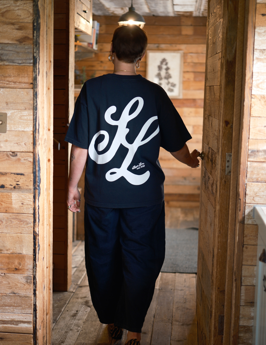 SL Script faded black t-shirt by Slow Love Knitwear crafted from premium 250gsm organic cotton.