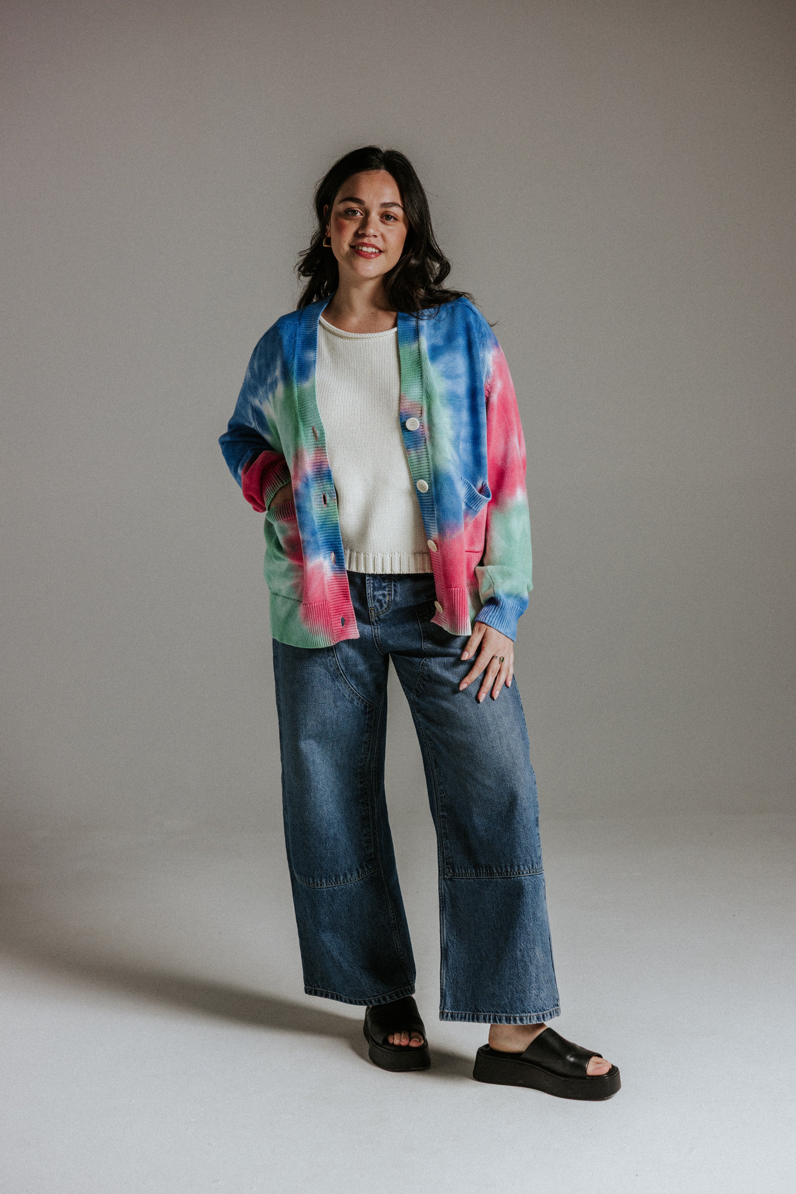 Hand tie-dyed cotton knit cardigan showing unique sun-washed colour variation by Slow Love Knitwear