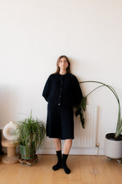 Women's midnight navy knitted shorts by Slow Love, designed with a comfortable elasticated waist and a cut just below the knee.
