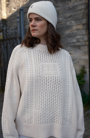 Oat Milk Aran Jumper in 100% cotton with traditional cable knit and integrated SL initials by Slow Love Knitwear