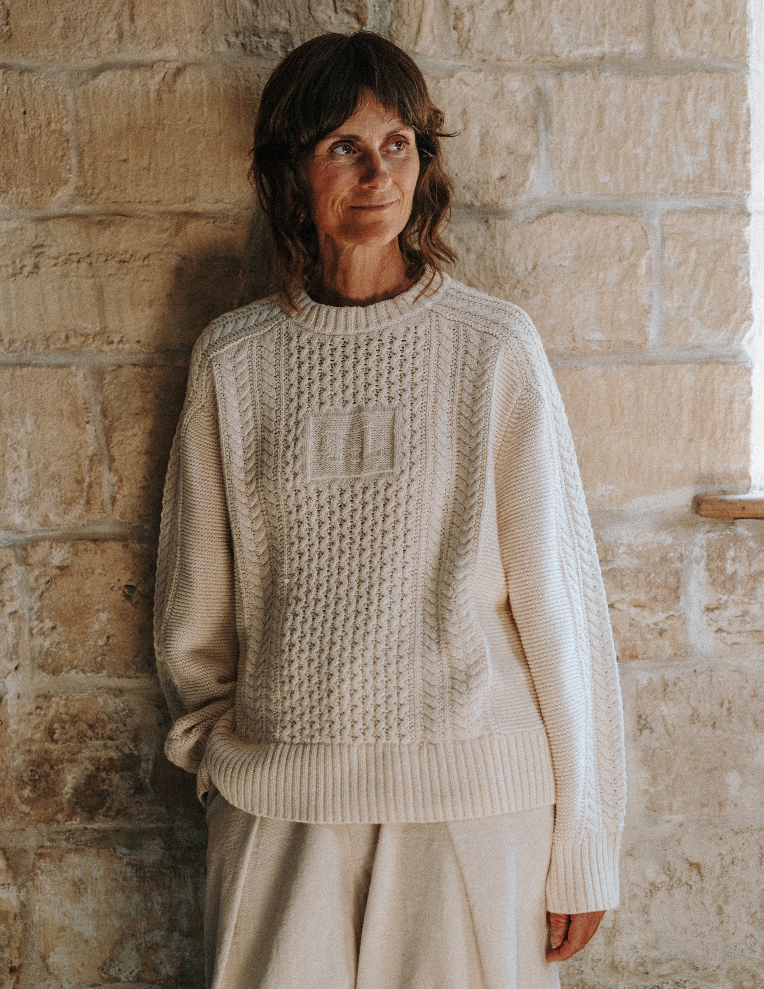 Oat Milk Aran Jumper in 100% cotton with traditional cable knit and integrated SL initials by Slow Love Knitwear