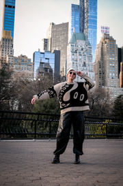 The Slow Love Octopus Wool Jumper, knitted from 100% RWS certified wool in a distinctive birdseye jacquard pattern.
