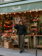 Oversized faded black cotton jumper by The Slow Love featuring a relaxed silhouette and sculptural balloon sleeves.