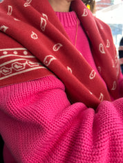 Red Bandana Scarf by Slow Love Knitwear, knitted from 100% luxury merino wool for a soft, warm and comfortable feel.