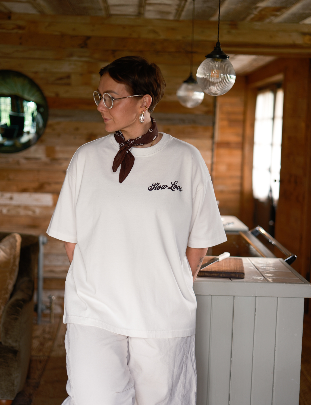 Slow Love Script oversized boxy t-shirt in off white made from heavyweight organic cotton, front view.