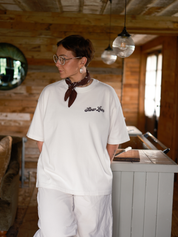 Slow Love Script oversized boxy t-shirt in off white made from heavyweight organic cotton, front view.