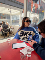 Slow Love Ski School Jumper styled with a nostalgic 1980s après-ski aesthetic for effortless winter dressing.