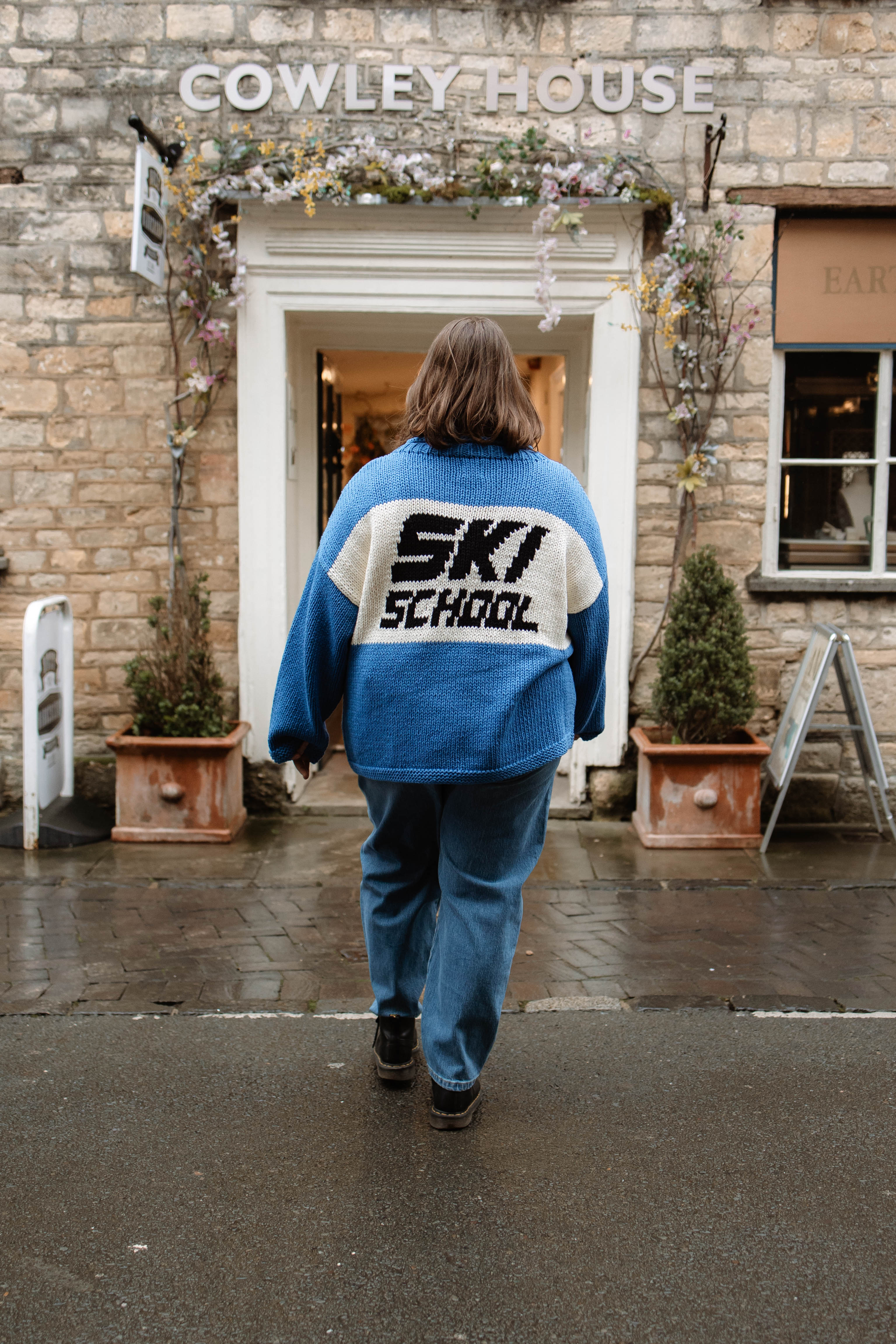 Back of the Slow Love Ski School Jumper, highlighting its chunky 100% cotton knit and distinctive ski-inspired design.