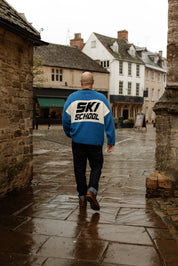 The Slow Love Ski School Jumper featuring the iconic oversized Feel Good Jumper shape and a relaxed, laid-back fit.